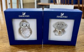 Swarovski Crystal Glass, two pieces including 'Angel with Golden Heart' and 'Christmas Ornament