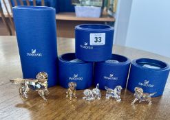 Swarovski Crystal Glass, a small collection of dogs including 'Labrador Puppy Standing', 'Golden