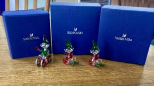 Swarovski Crystal Glass, three pieces including 'Santa's Elf on Sleigh' and two 'Santa's Elf -