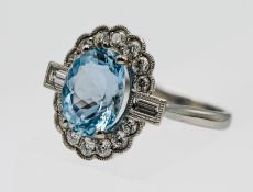 A fine platinum diamond and aquamarine cluster ring set with fourteen brilliant cut diamonds, size