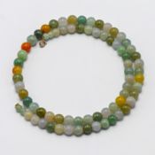 A multi coloured jade bead necklace with a 9k clasp, approx 104.1g.