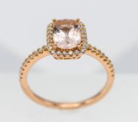 An 18ct rose gold diamond and morganite ring, size M/N