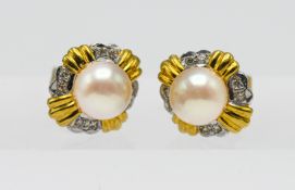 A pair of 18ct yellow gold diamond and pearl stud earrings.