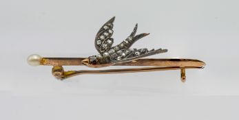 A classic swallow bar brooch set with rose cut diamonds and ruby, unmarked.