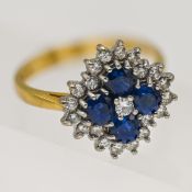 A diamond and sapphire cluster ring set in 18ct yellow gold, size P.