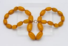 A graduated butterscotch colour amber necklace with bolt ring fitting, approx 68.4g, twenty five