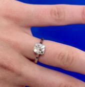 A good cushion old cut diamond solitaire ring set in 18ct yellow gold