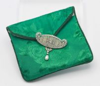 A fine scallop curved oval erne shaped plaque brooch, set with diamonds and seed pearls, white metal