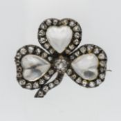 A Victorian clover leaf design brooch set with diamonds and moonstone/rose quartz heart designs,