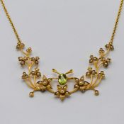 Kismet, a seed pearl and peridot flower pendant/necklace set in 15ct yellow gold.