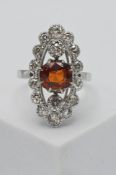 An 18ct white gold diamond marquise ring, size Q.