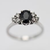 An 18ct white gold diamond and sapphire cluster ring circa 1970's, size M/N.