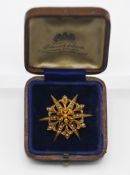 A 15ct yellow gold seed pearl star brooch, approx. 5.60g, with boxed.