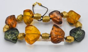 A large contemporary style chunky amber stone necklace.