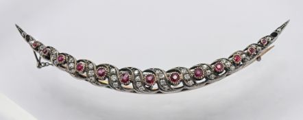 A large antique diamond and ruby crescent brooch, approx 10g, not hallmarked.