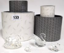 Swarovski Crystal Glass, a collection of four swans, boxed, (yellow glue on the largest swan).