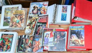 A collection of comics, paper wallets, 6 folders of laminated copies of art from various series,