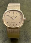 Omega, a gents De Ville automatic wristwatch, set in 18ct yellow gold, milanese bracelet, number
