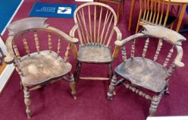 Three wood armchairs from the studio of Robert Lenkiewicz, turned backs and legs, one on casters.