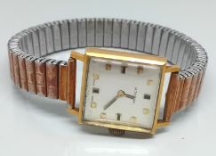 An 18ct Rotary wrist watch, on a gilt metal expanding strap, total weight 32.3g.