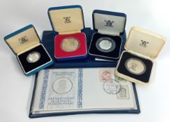 A large collection of commemorative coins, to include a 1997 deluxe proof set, an Italian 500th