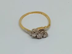 An 18ct three stone ring, weight 2.2g.
