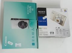 Two as new digital cameras, to include a Sony DSC-S2000 Cyber-Shot, and a Canon IXUS 70, both boxed.
