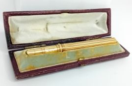 A yellow metal, probably gold, fountain pen, maker S. Mordan and Co., in a fitted case, closed