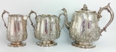 A Victorian silver tea service by Elkington and Co., to include a teapot with flower bud finial