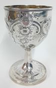 A William IV silver goblet, of engraved and embossed foliate decoration, hallmarked London 1827,