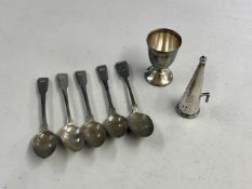 An Irish silver candle snuffer (hallmarks rubbed), a silver egg cup and a set of four silver