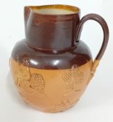 A late 19th century Doulton Lambeth Stoneware jug, with hunting relief figures, height 15.5cm.