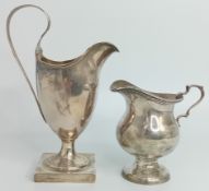 A silver jug, hallmarked Chester 1912, together with another on a square base, hallmarked Birmingham