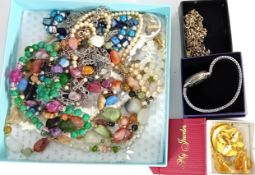 A large quantity of costume jewellery, to include yellow and white metal bracelets, brooches,