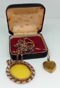 Two yellow metal pendants on chains, one chain marked 9ct gold, total weight 23.3g. (2)