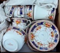 A Lawleys of Regent Street china tea set, decorated with blue rim and roses, to include 5 cups, 6