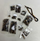 A collection of 'Tigers eye' style beads, loose.