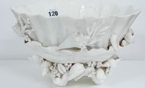 A hard paste porcelain raised bowl, decorated with shell and coral sculpture.