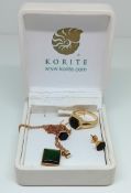 A 14ct gold green stone set, to include a ring, pendant necklace on a chain, and pair of stud