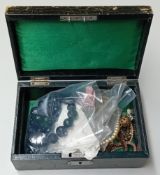 A leather jewellery box, to include a jet bead necklace, pearls, beads, etc.