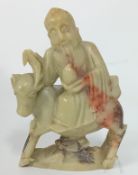 A Chinese soapstone carved mounted figure, height 12cm.