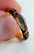 A George I gold and black enamel skeleton memento mori ring, with raised coffin stone concealing a