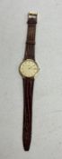 Eterna, a gents 9ct gold date quartz wristwatch with gold baton dial.