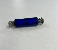 A blue glass lined double end scent bottle.