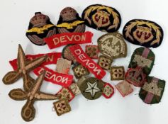 A collection of 20th century embroidered military badges, to include an RAF officer's Kings Crown
