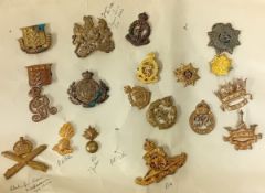 A collection of 20th century cap badges, to include a Machine Gun Corps, Ubique Fusiliers collar