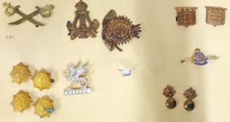 A collection of 20th century cap badges, to include a Salvation Army Blood and Fire, an APC