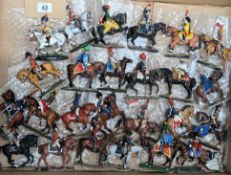 A collection of painted and part-painted figures of Napoleonic guards, soldiers, calvary and