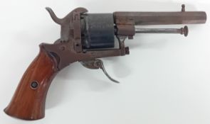 A 19th/early 20th century pin revolver, 7mm calibre, with wooden stock, length approx 19cm.