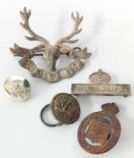 A collection of 20th century cap badges, to include a 3rd Battalion Leeds Rifles P.W.O West